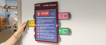 patient room signage with symbols